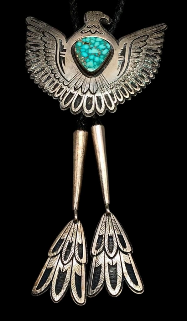 Phenomenal Victor C. Thunderbird Bolo Tie: Offered here for your consideration is a phenomenal Victor Coochwytewa made Thunderbird theme bolo tie. The slide features a turquoise cabochon accented with a bird overlay design of silver on a textu