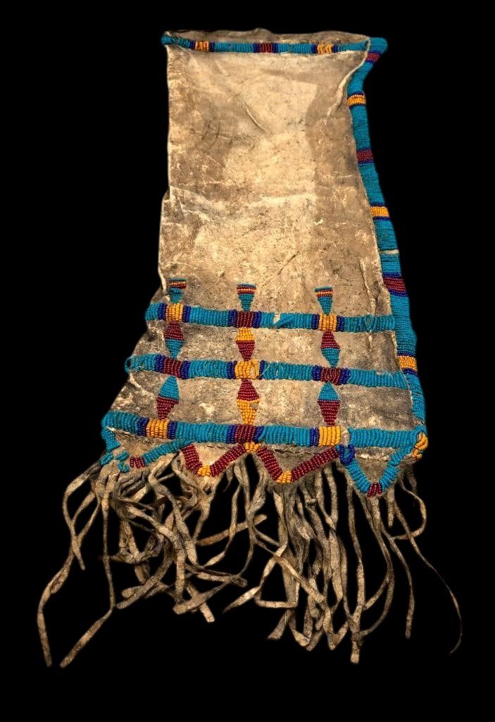 Late 1800s Cheyenne Beaded Pipe Bag With Historical Provenance: Offered here for your consideration is a late 1800s Cheyenne beaded pipe bag with historical provenance. This piece features beadwork of geometric designs done in colors of blue, yellow and red. The b