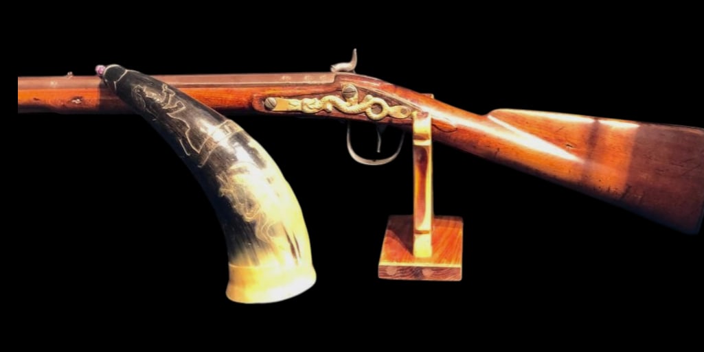 Barnett Trade Musket Percussion Conversion With Carved Powder Horn: Offered here for your consideration is a Barnett trade musket, percussion conversion, with a hand carved powder horn. The musket features a hardwood stock, brass butt plate, and is a smooth bore barre