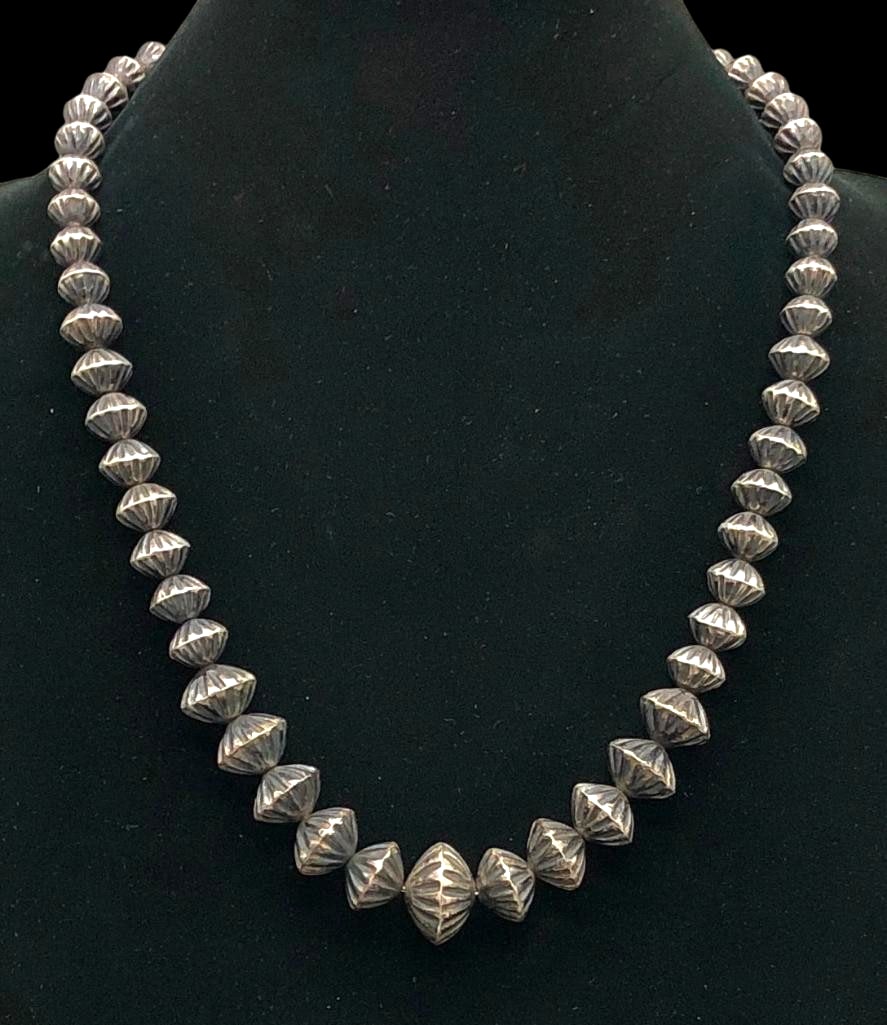 Vintage Sterling Silver Fluted Bead Necklace: Offered here for your consideration is a vintage sterling silver fluted bead necklace. This piece features a strand of fluted beads in graduated sizes strung on a silver chain with findings. Add this 