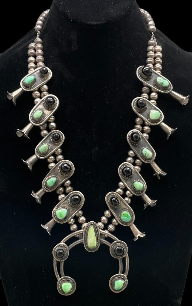 Green Turquoise, Onyx And Sterling Silver Squash Blossom Necklace With 4 Petal Blossoms: Offered here for your consideration is a green turquoise, onyx and sterling silver squash blossom necklace with four petal blossoms. The two wire naja features three green turquoise and two onyx caboc