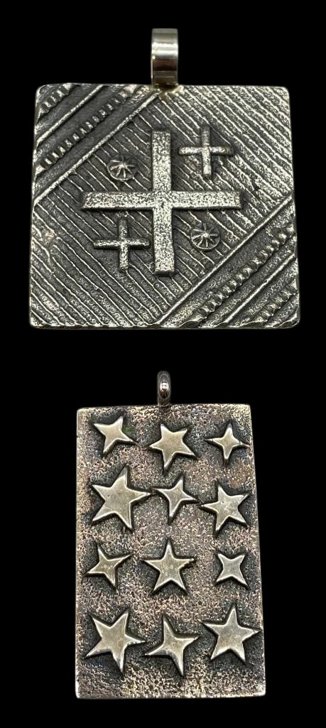 Two Cast Sterling Silver Pendants By Stanford Yazzie And Kevin Yazzie: Offered here for your consideration are two cast sterling silver pendants by Stanford Yazzie and Kevin Yazzie. Both pieces feature tufa cast designs showcasing raised star and cross motifs on darkened