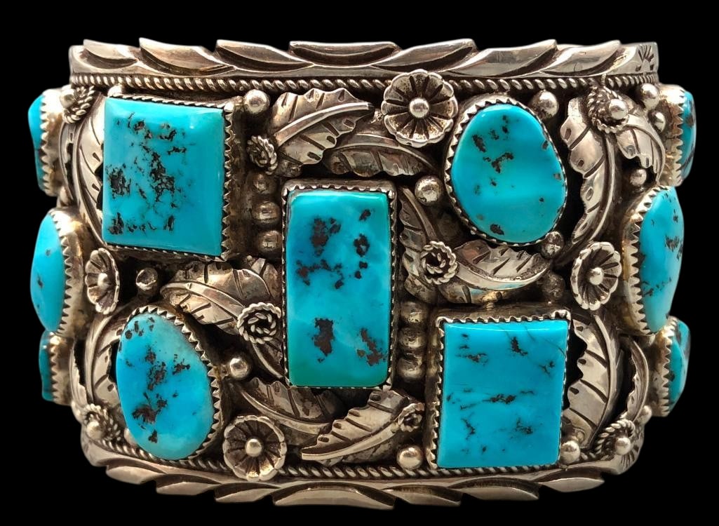 13 Stone Turquoise And Sterling Silver Bracelet: For your bidding enjoyment we present a 13 stone turquoise and sterling silver bracelet. This bracelet features turquoise cabochons in round and square designs, all set in sawtooth silver bezels. The 