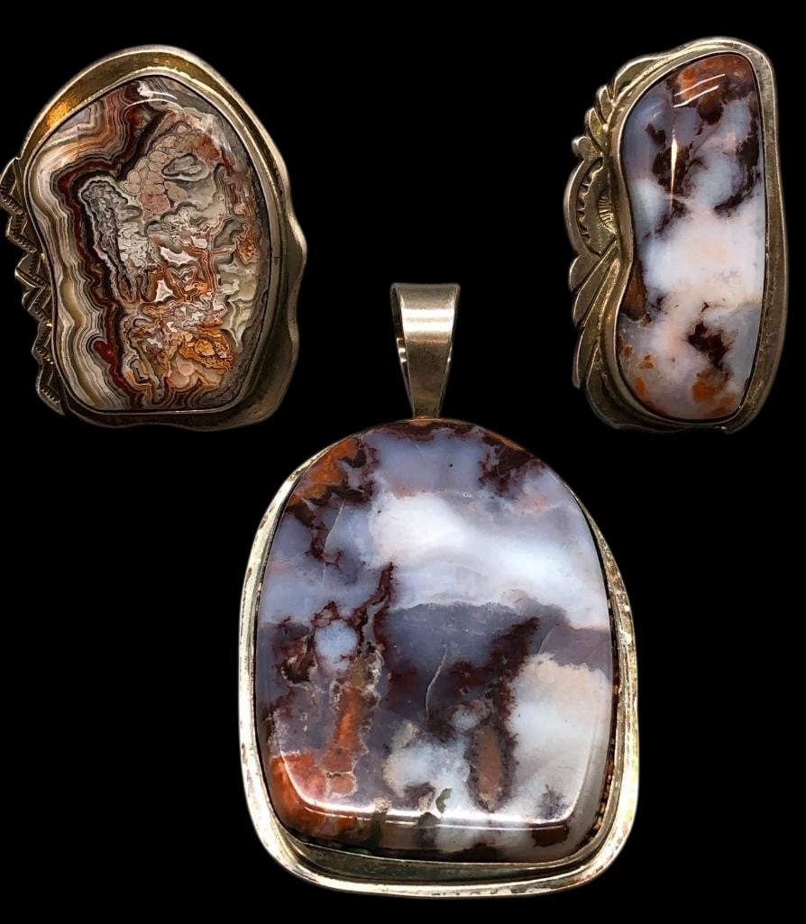 Two Sterling Silver And Agate Rings With Pendant: Offered here are two sterling silver and agate rings with pendant. Each piece features an agate cabochon set in a smooth silver bezel framed by silver borders, some accented with hand stamped patterns