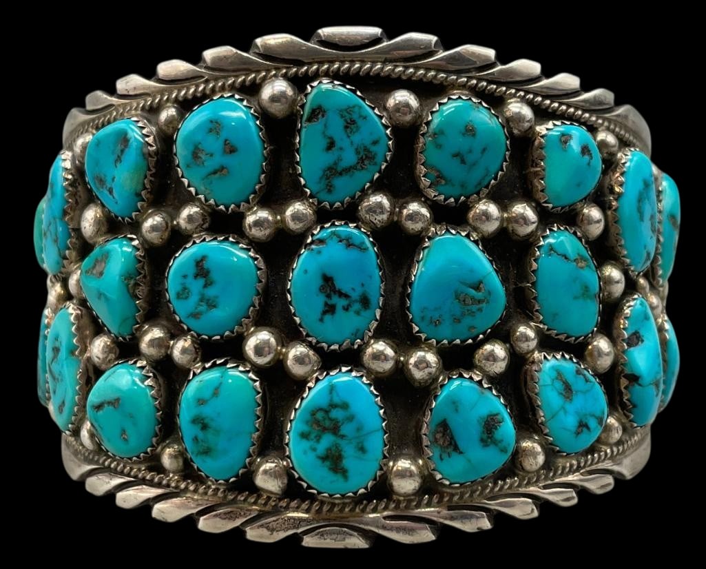 Turquoise And Sterling Silver Cluster Bracelet: Presented here for your bidding pleasure is a turquoise and sterling silver cluster bracelet. This classic bracelet features turquoise cabochons set in sawtooth silver bezels displayed on a darkened s