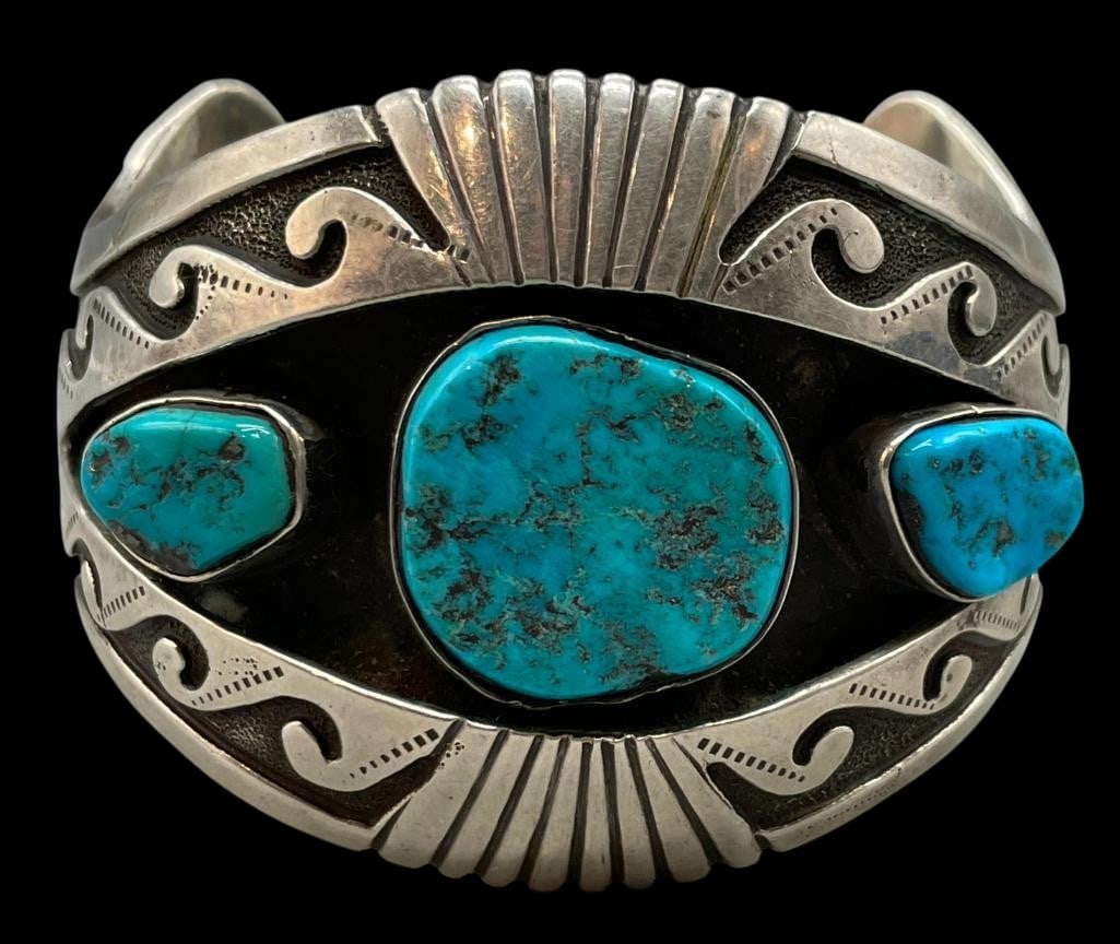 Sterling Silver And Turquoise Shadowbox Style Bracelet: For your bidding enjoyment we present a sterling silver and turquoise shadowbox style bracelet. This bracelet features three turquoise cabochons set in handmade silver bezels. Surrounding the stones i