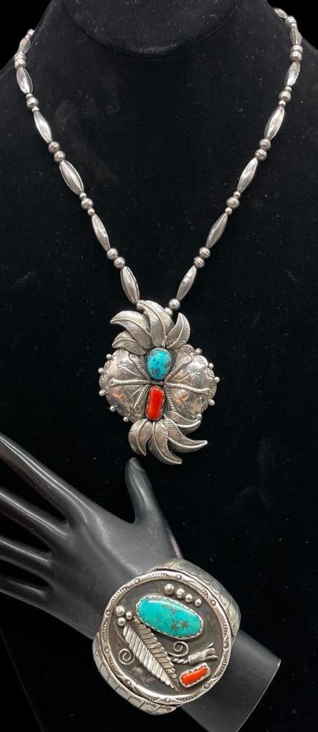 Sterling Silver, Turquoise And Coral Bracelet With Nice Silver Necklace: Offered here are a sterling silver, turquoise and coral bracelet with a nice silver necklace. The pendant and bracelet are each highlighted with coral and turquoise cabochons set in scalloped silver b