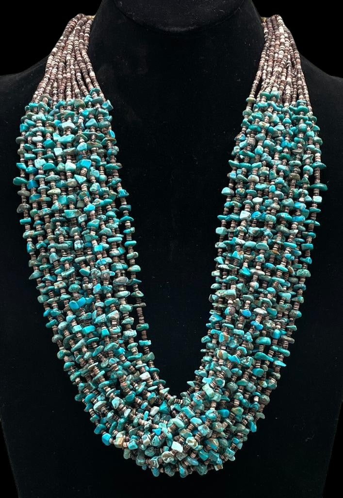 20 Strand Turquoise And Heishi Necklace: Offered here for your consideration is a 20 strand turquoise and Heishi necklace. This amazing necklace features nice turquoise beads interspersed with brown Heishi beads throughout. The beads are str