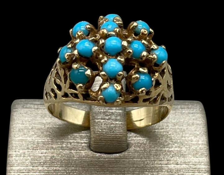 14K Gold And Turquoise Cluster Ring: Offered here for your consideration is a 14K gold and turquoise cluster ring. This piece features a cluster of snake eye/dot turquoise cabochons set in gold bezels. It is finished with a 14K gold band
