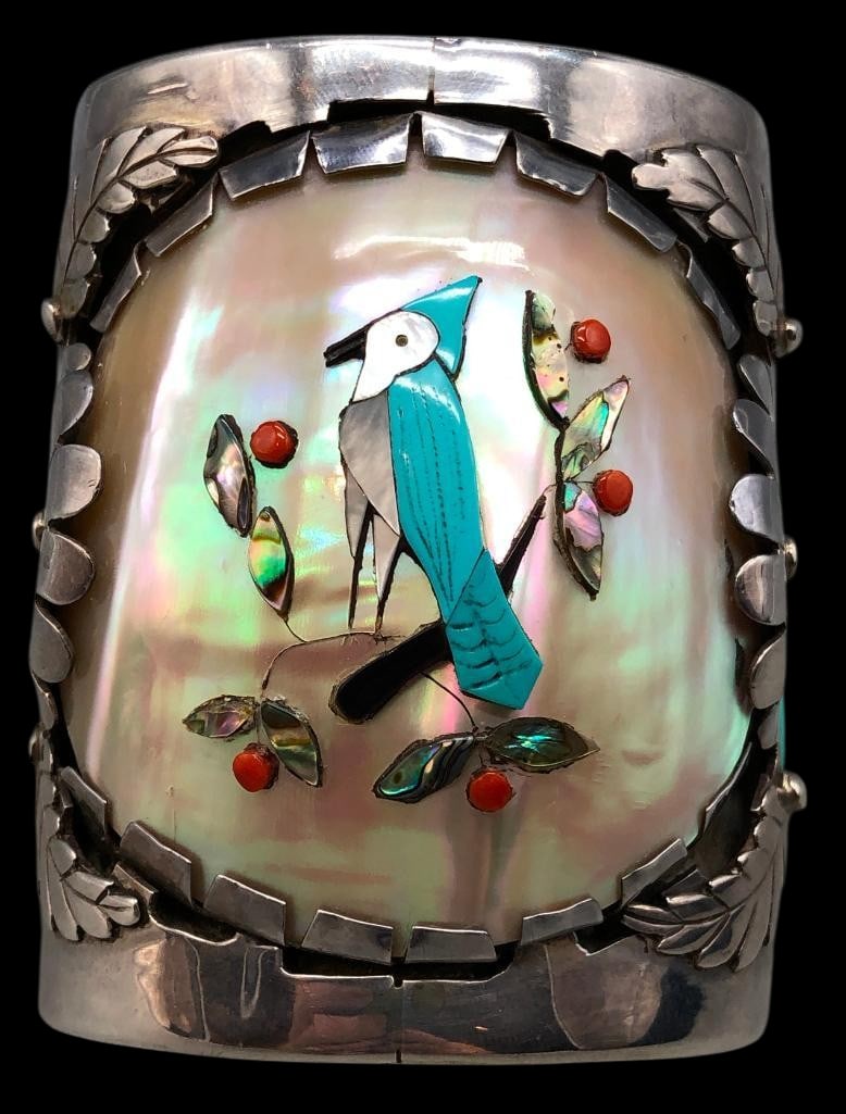 Large Jones Quam Zuni Inlay And Sterling Silver Bracelet: Offered here for your consideration is a large Jones Quam Zuni inlay and sterling silver bracelet. This piece features a raised multi stone pictoral inlay of turquoise, coral, abalone and onyx on a