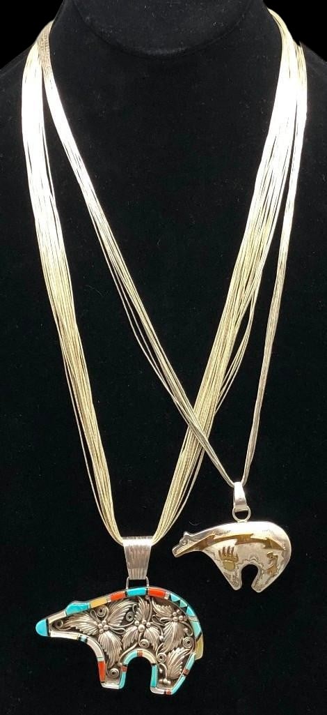 Two Bear Themed Sterling Silver Necklaces: Offered here for your consideration are two bear themed sterling silver necklaces. The pendants on both necklaces showcase a bear design. One pendant features gold toned overlay style designs accented