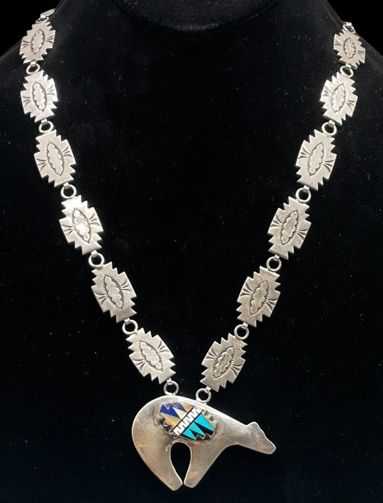 Double Sided Bear Themed Sterling Silver Necklace: Offered here for your consideration is a double sided bear themed silver necklace. The pendant features a bear design with one side showcasing a multi stone inlay of turquoise, lapis, mother of pearl 