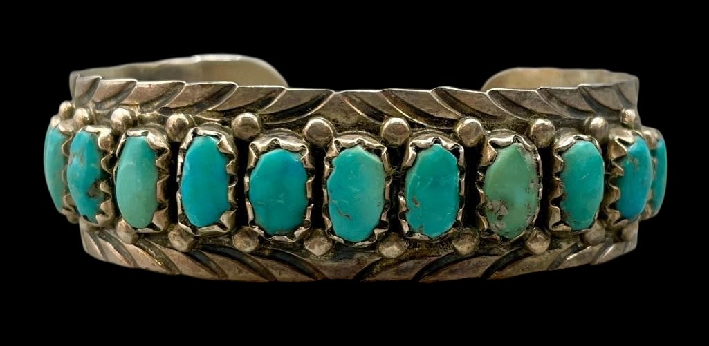 12 Stone Turquoise And Sterling Silver Bracelet: Offered here for your consideration is a 12 stone turquoise and sterling silver bracelet. This piece features 12 turquoise cabochons set in sawtooth silver bezels accented with silver dots and hand st