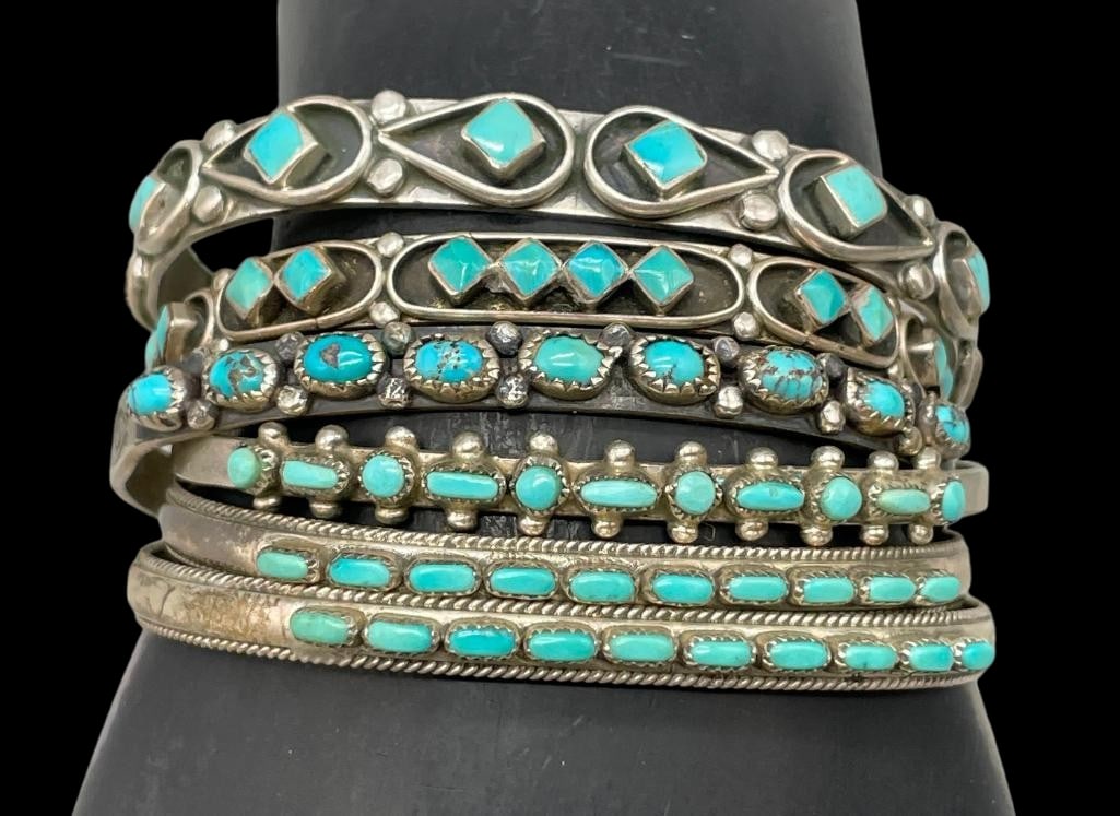 Six Sterling Silver And Turquoise Stacker Style Bracelets: Offered here for your consideration are six sterling silver and turquoise stacker style bracelets. Each piece features a row of turquoise cabochons with two showcasing square shapes and one row in a d