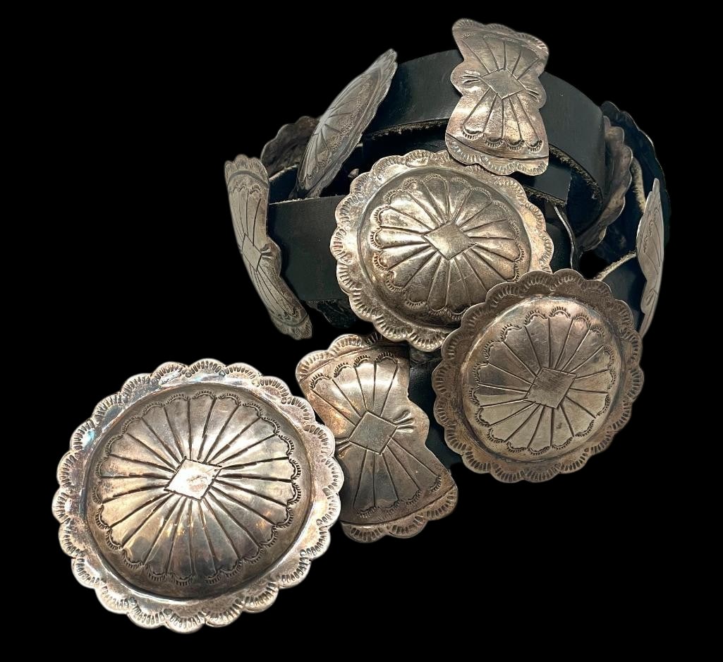 Sterling Silver Concho Belt With Stamped Designs: Offered here for your consideration is a sterling silver concho belt with stamped designs. The belt has eight butterfly conchos, seven round conchos and buckle. Each are highlighted with raised center