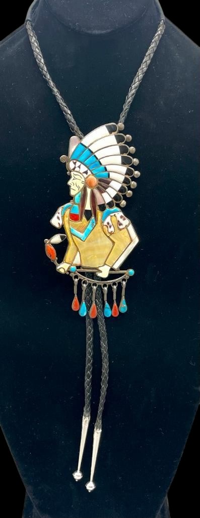 Chief Profile Zuni Inlay Bolo Tie By Ralph Quam: Offered here for your consideration is a Chief profile Zuni inlay bolo tie by Ralph Quam. The slide feature a multi stone Chief's design inlay of mother of pearl, onyx, coral, turquoise and others