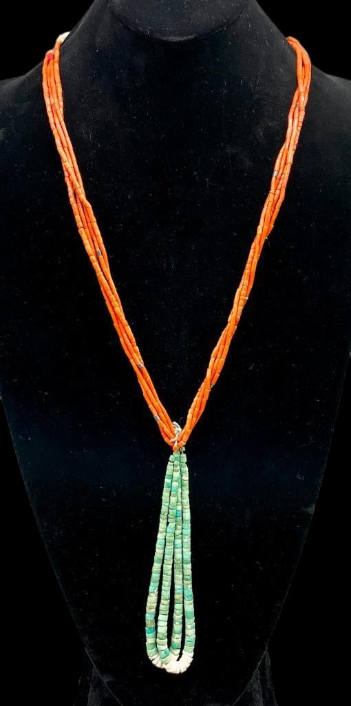 Multi Strand Coral Necklace With Joclas: Offered here for your consideration is a multi strand coral necklace with joclas. This piece features four strands of coral beads accented with sterling silver beads. Hanging from the strands are two 