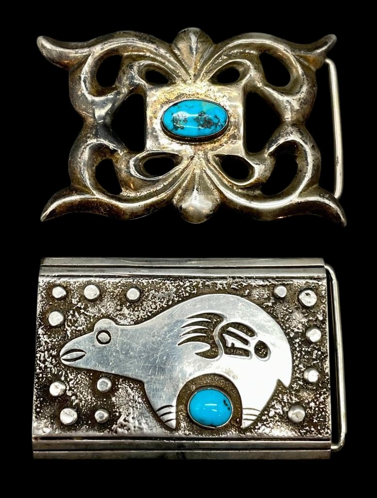 Two Sterling Silver And Turquoise Belt Buckles: Offered here for your consideration are two sterling silver and turquoise belt buckles. Both pieces feature a turquoise cabochon set in a smooth silver bezel. Accenting the stone on one buckle are