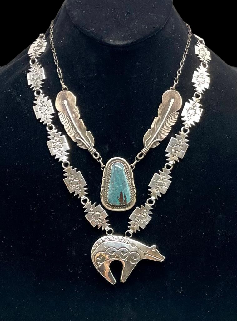 Two Sterling Silver Necklaces - Bear And Feather Themed: Available here for your consideration are two sterling silver necklace - bear and feather themed. The first piece features a central bear pendant accented with hand stamped designs. The neckline is