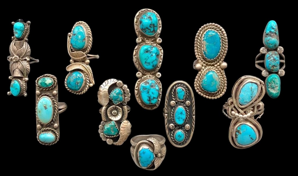 10 Sterling Silver And Turquoise Rings: Offered here are 10 sterling silver and turquoise rings. These pieces are highlighted each with turquoise cabochons set in silver bezels. Accenting the stones is silver work of dots, twisted wires,