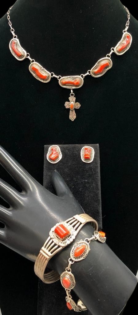 Sterling Silver And Coral Necklace And Pair of Earrings With Two Bracelets: Offered here for your consideration is a sterling silver and coral necklace, pair of earrings and two bracelets. All of the pieces except the link bracelet, feature coral cabochons set in silver bezel