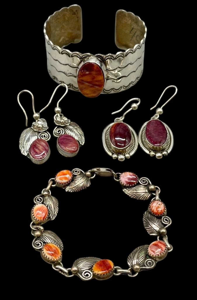 Two Sterling Silver And Spiny Oyster Bracelets With Two Pair of Earrings: Available here for your consideration are two sterling silver and spiny oyster bracelets with two pairs of earrings. The first bracelet features a beautifully shaped cuff adorned with hand stamped pat