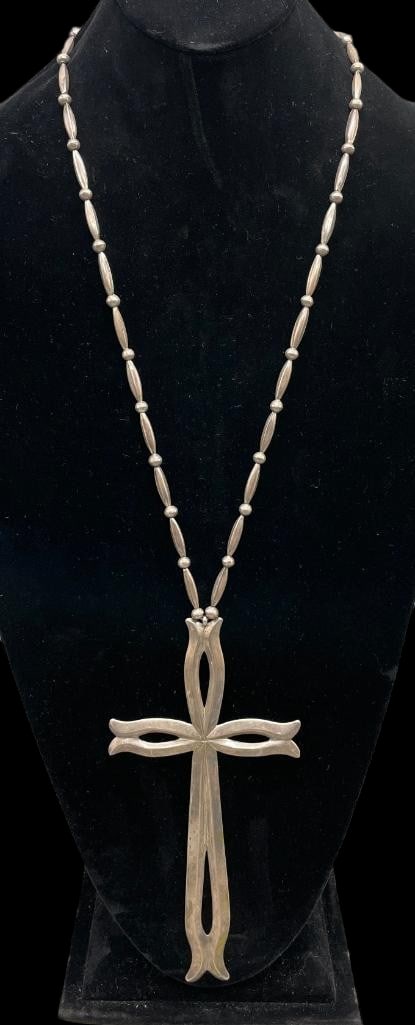 Large Sterling Silver Cast Cross Necklace: Offered here for your consideration is a large sterling silver cast cross necklace. This necklace features a large pendant with a carinated cross shape. It hangs from a strand of sterling silver beads