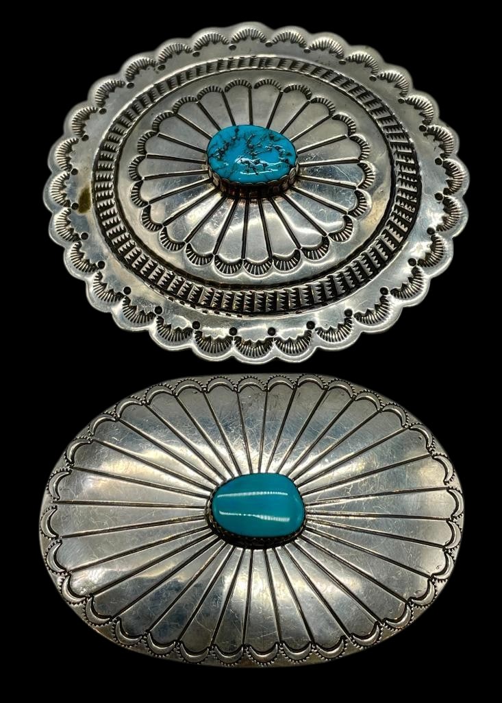 Two Sterling Silver And Turquoise Belt Buckles: Offered here for your consideration are two sterling silver and turquoise belt buckles. Each buckle is highlighted with a central turquoise cabochon set in a silver bezel surrounded by hand stamped