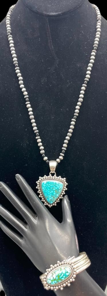 High Grade Turquoise, Sterling Silver Bracelet and Beaded Necklace With Pendant By Artie Yellowhorse: Offered here for your consideration is a high grade turquoise, sterling silver bracelet and beaded necklace with pendant by Artie Yellowhorse. Both pieces feature a turquoise cabochon set in a smooth 