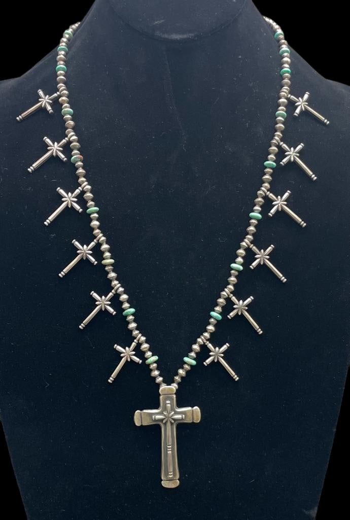 Sterling Silver And Turquoise Cross Theme Necklace: Offered here for your consideration is a sterling silver and turquoise cross theme necklace. The central pendant showcases a cross design highlighted with a raised cross motif. The neckline is filled 