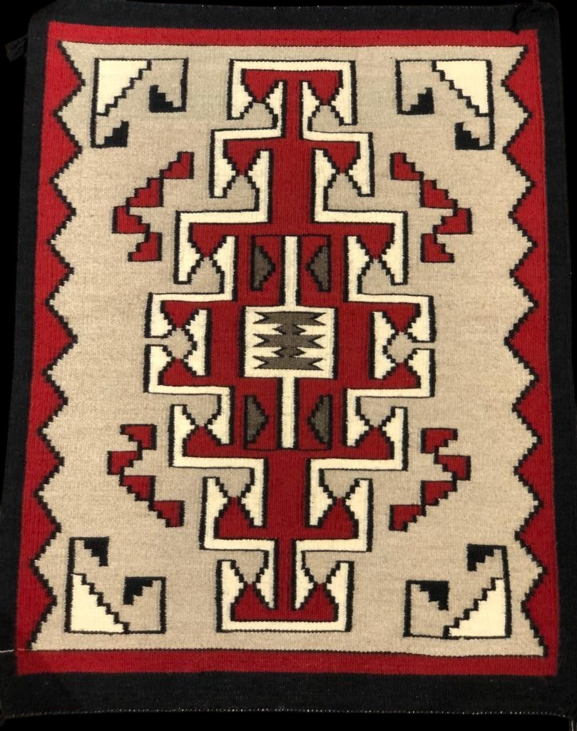 Klagetoh Style Design Navajo Rug: Available here for your consideration is a Klagetoh design Navajo rug. This rug was woven with commercially spun wool and features the standard center red design with geometric patterns in the four co