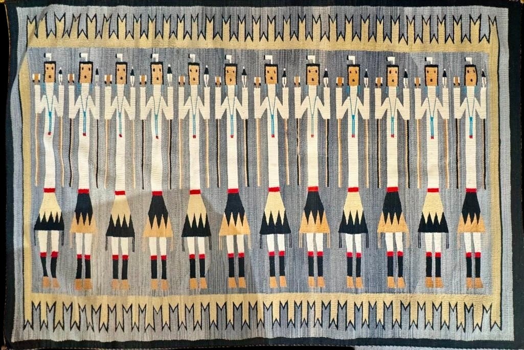 Vintage Yei Pictorial Design Navajo Weaving Circa 1960s: Available here for your consideration is a vintage Yei pictorial design Navajo weaving from circa the 1960s which features 12 Yei figures in a row, each holding a feather in one hand and other items
