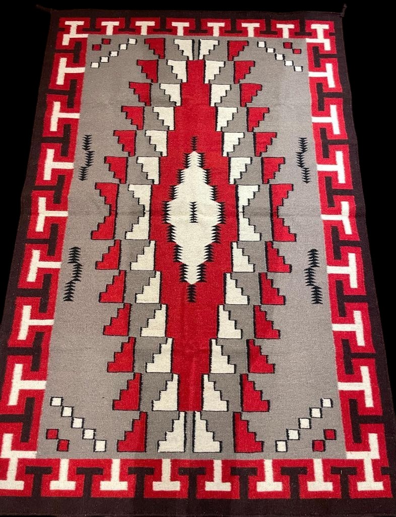 Southwest Style Zapotec Rug: Available here for your consideration is a large Southwest style Zapotec Rug which features a pattern that resembles a Klagetoh style weaving. The main center is a reddish geometric pattern centered