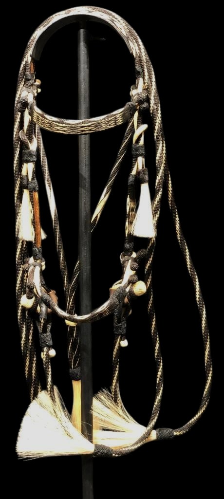 Prison Made Hitched Horsehair Bridle: Offered here for your consideration is a prison made horsehair bridle featuring hitched horsehair work done in shades of black, cream and tan in various geometric patterns. It has horsehair tassels an