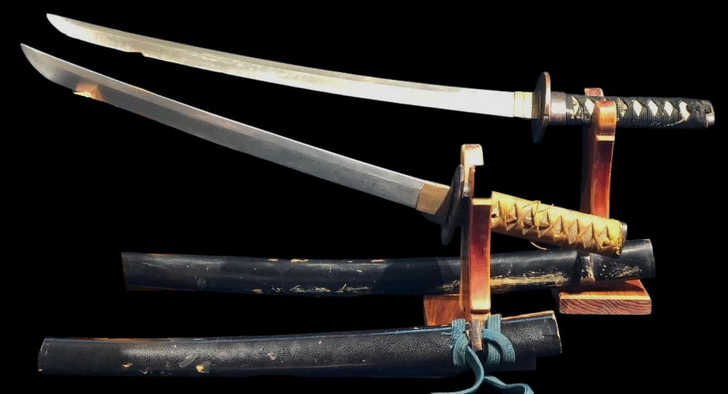 Two Japanese Wakizashi Short Swords - One Edo Period And One WWII Era: Offered here for your consideration are two Japanese wakizashi short swords and one is from the Edo Period and one is circa WWII era. These swords feature curved, single edged steel blades