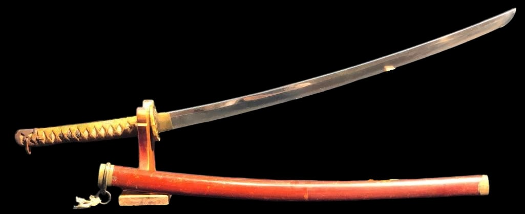 Japanese WWII era Katana - Sword: Offered here for your consideration is a Japanese WWII era Katana -sword. This sword features a curved, single edged steel blade with a brass tsuba and habaki collar. The wrapped handle has floral