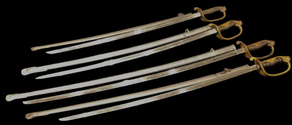 Group Of Four Japanese Army Type Swords: Offered here for your consideration is a group of four Japanese Army type swords. They feature curved, single edged steel blades with fullers along the blades. The swords are fitted with brass guards 