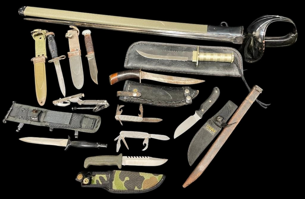 Group of Misc US Military Knives And Sword: Offered here for your consideration is a group of miscellaneous military knives and a sword. The group includes fixed blade knives, folding knives, multi-tools, and survival style knives. Several kniv