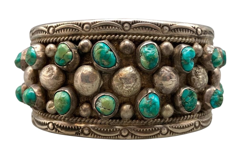 Vintage Turquoise And Sterling Silver Cluster Bracelet: Offered here for your consideration is a vintage turquoise and sterling silver cluster bracelet. This piece features two rows of turquoise cabochons set in smooth silver bezels. Accenting the stones a