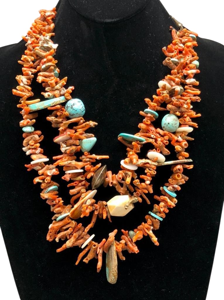 Three Strand Multi Stone Necklace: Offered here for your consideration is a three strand multi stone necklace. This necklace features strands of primarily coral branch beads accented with turquoise, shell and other beads throughout. Th