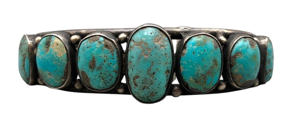 Seven Stone Natural Turquoise And Sterling Silver Bracelet: Offered here for your consideration is a seven stone natural turquoise and sterling silver bracelet. This piece features seven turquoise cabochons set in smooth silver bezels accented with silver dots
