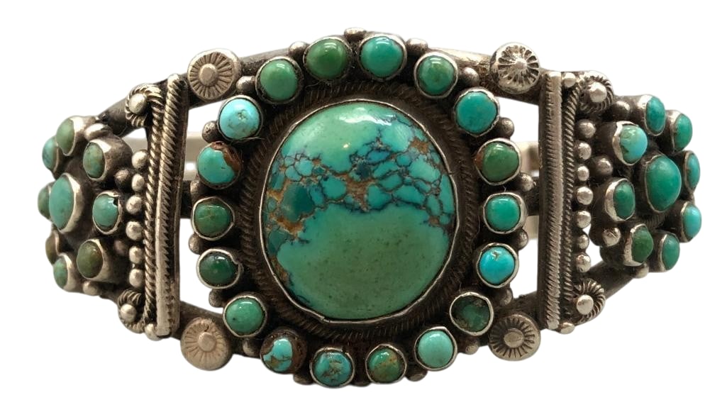 Circa 1920s-1930s Natural Turquoise And Sterling Silver Bracelet: Offered here for your consideration is a circa 1920s-1930s natural turquoise and sterling silver bracelet. This piece features clusters of turquoise cabochons set in smooth silver bezels. Accenting th
