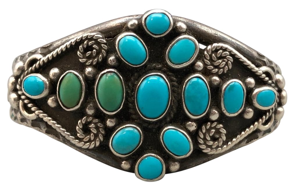 Circa 1930s Natural Turquoise and Sterling Silver Bracelet: Offered here for your consideration is a circa 1930s natural turquoise and sterling silver bracelet. This piece features turquoise cabochons set in smooth silver bezels. Accenting the stones are silve