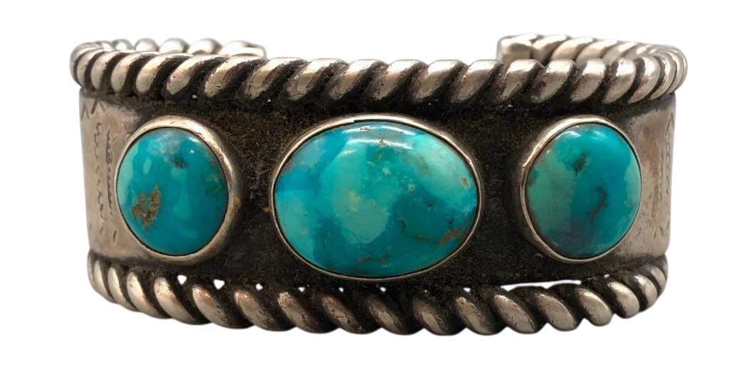 Circa Mid Century Natural Turquoise And Sterling Silver Bracelet: Offered here for your consideration is a circa mid century natural turquoise and sterling silver bracelet. This piece features three turquoise cabochons set in smooth silver bezels accented with hand 