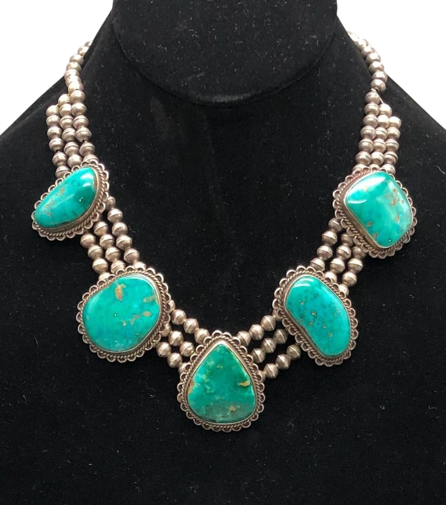 Blue Gem Turquoise And Sterling Silver Necklace: Offered here for your consideration is a Blue Gem turquoise and sterling silver necklace. This piece features five pendants each highlighted with a Blue Gem turquoise cabochon set in a smooth silver b