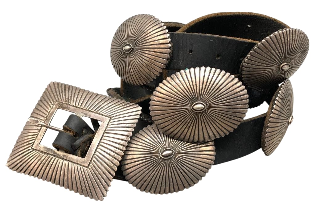 Deeply Stamped Sterling Silver Concho Belt by G. Begay: Offered here for your consideration is a deeply stamped sterling silver concho belt by G. Begay. This piece features 10 oval conchos and a rectangular buckle each highlighted with hand stamped designs
