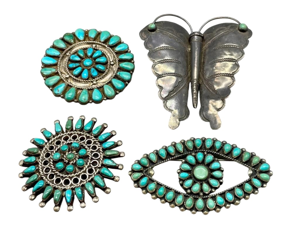 Four Vintage Turquoise And Sterling Silver Pins: Offered here for your consideration are four vintage turquoise and sterling silver pins. These pieces feature a variety of designs including clusters of turquoise cabochons and silver butterfly design