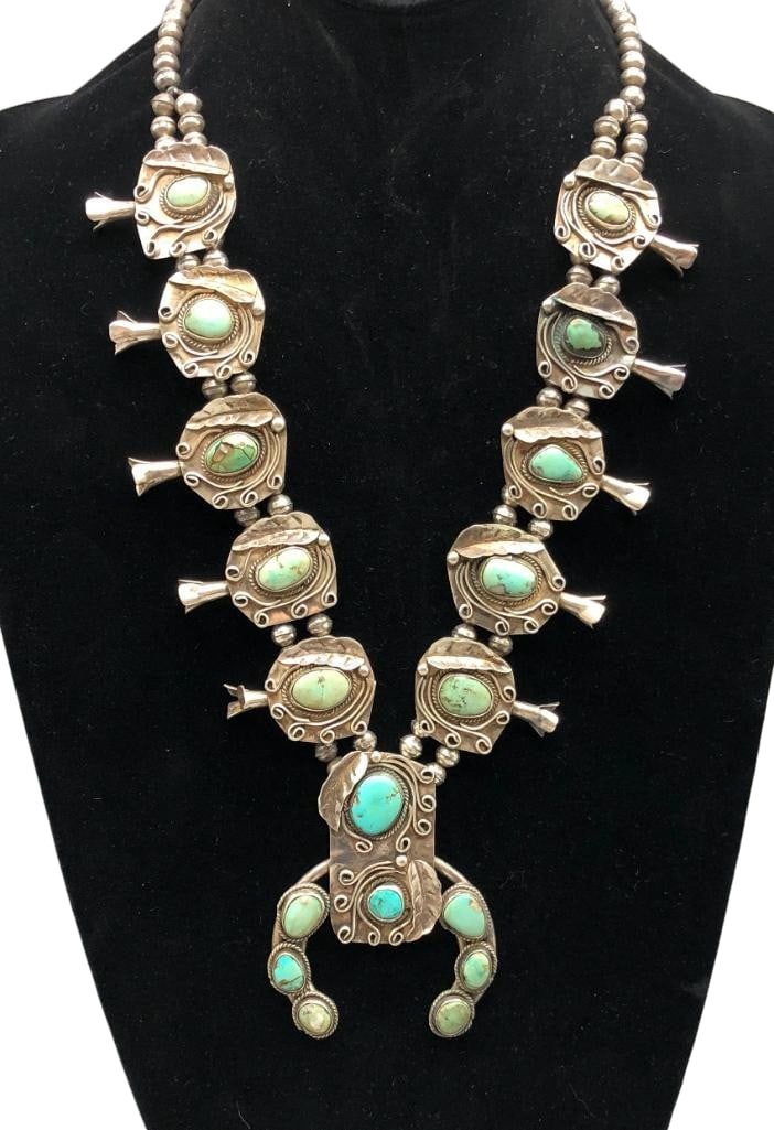 Vintage Turquoise And Sterling Silver Squash Blossom Necklace: Offered here for your consideration is a vintage turquoise and sterling silver squash blossom necklace. The two wire naja features eight turquoise cabochons set in smooth silver bezels accented with l