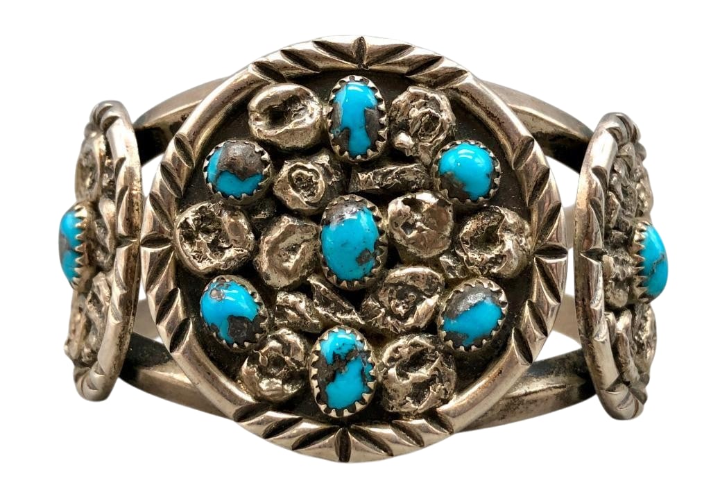 Persian Turquoise and Sterling Silver Cluster Bracelet by E. Yazzie: Offered here for your consideration is a Persian turquoise and sterling silver and cluster bracelet by E. Yazzie. This piece features Persian turquoise cabochons set in sawtooth silver bezels. Accenti