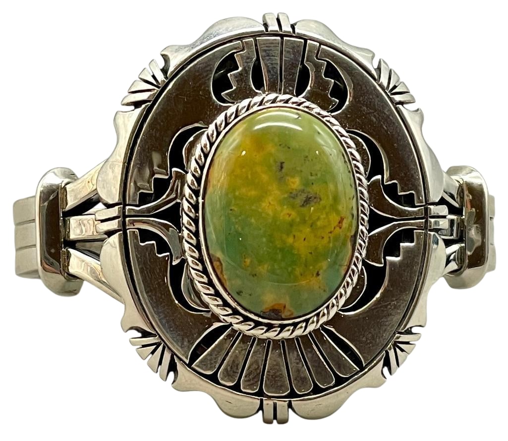 Green Turquoise And Sterling Silver Bracelet By Eugene Belone: Offered here for your consideration is a green turquoise and sterling silver bracelet by Eugene Belone. This piece features a green turquoise cabochon set in a smooth silver bezel accented with twiste